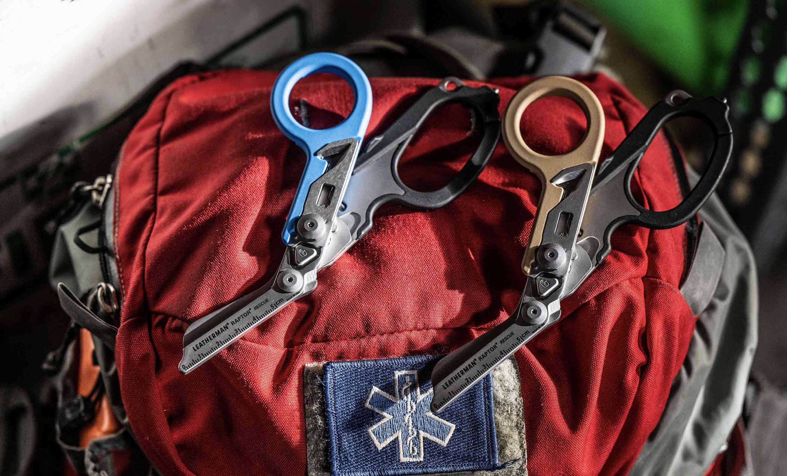 two_raptor_rescues_with_closed_shears_laying_on_top_of_a_backpack_20260402201735.jpg